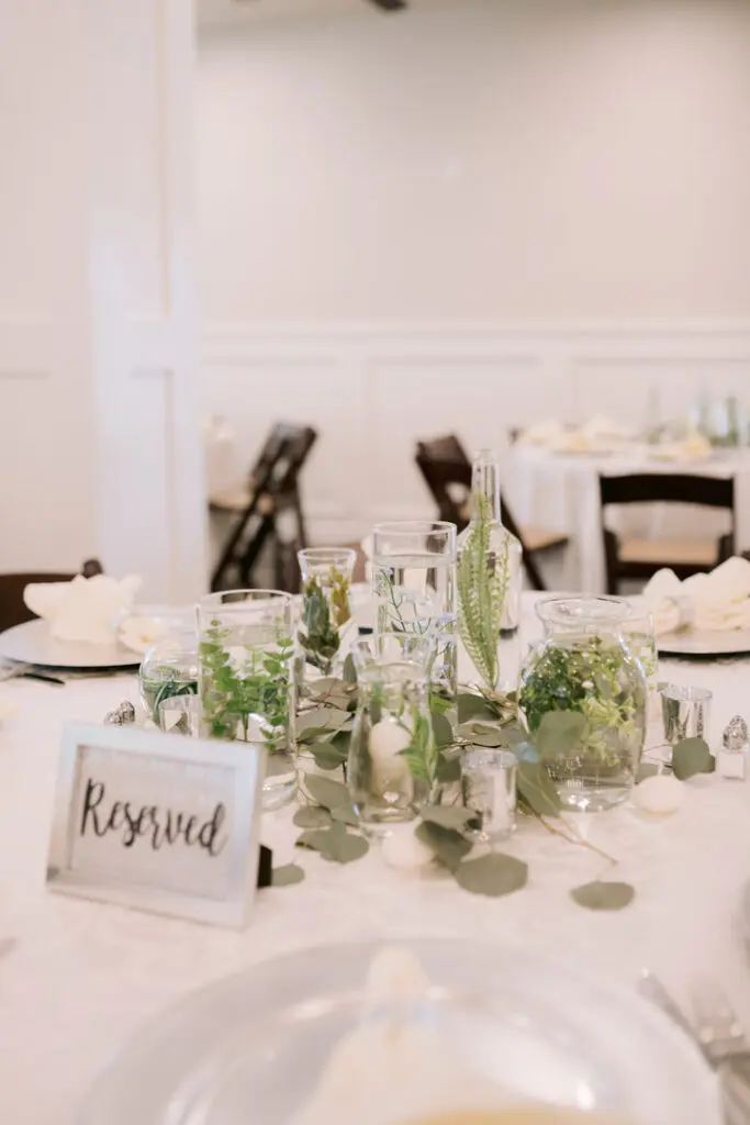 white table setting with reserved sign