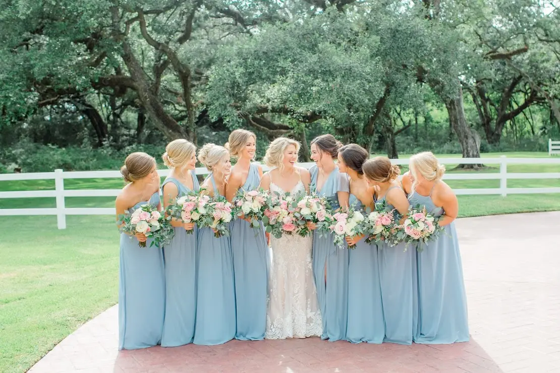 bride and bridesmaids wearing blue dresses