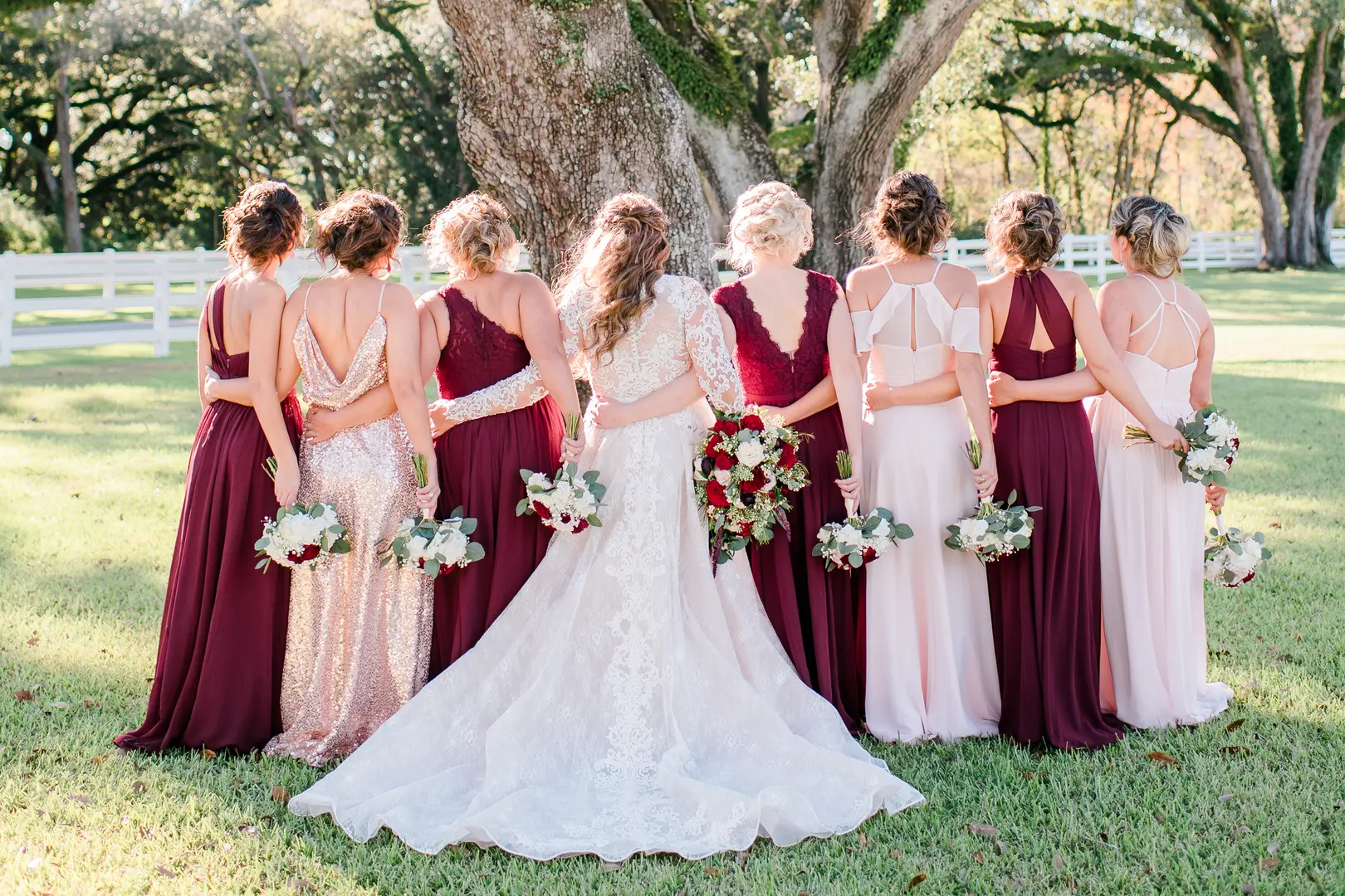 bride and bridesmaids wearing red and white dresses