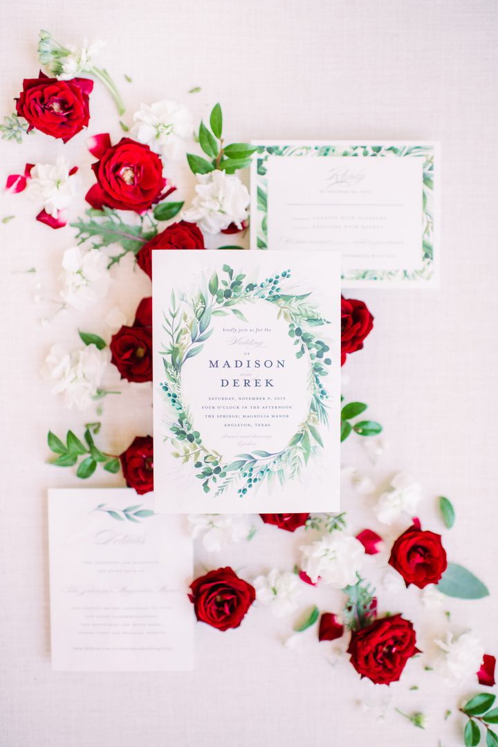 wedding invitation and white and red roses